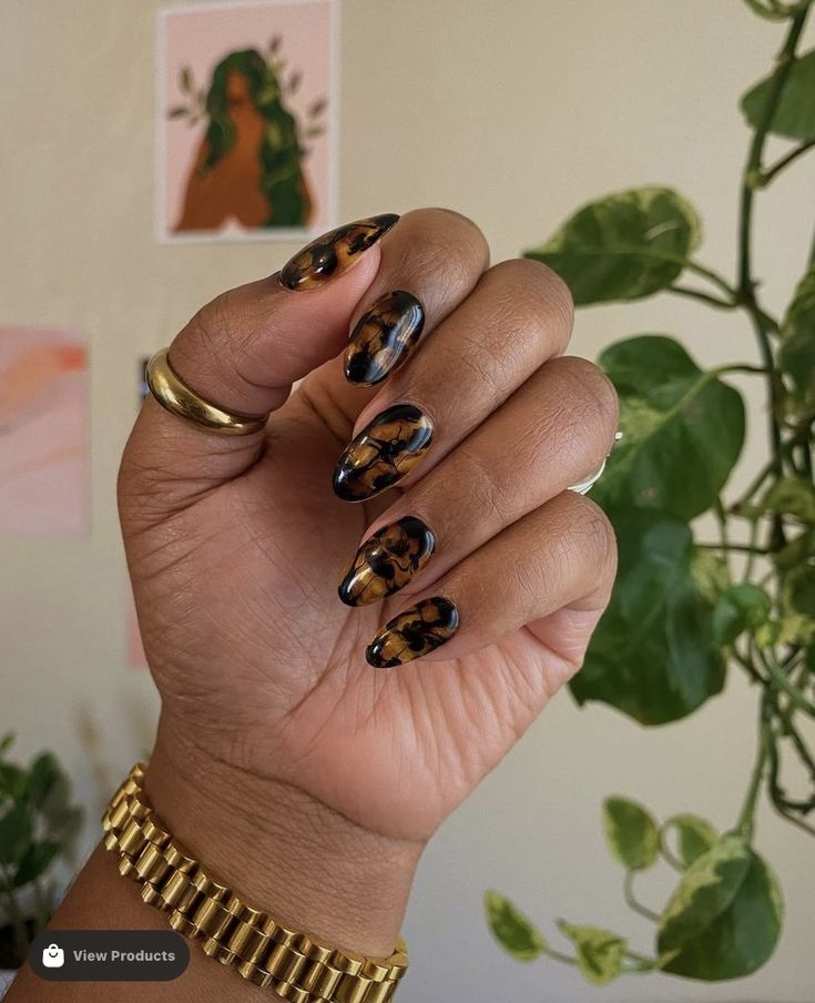 Tortoise shell nail art on short almond shaped nails