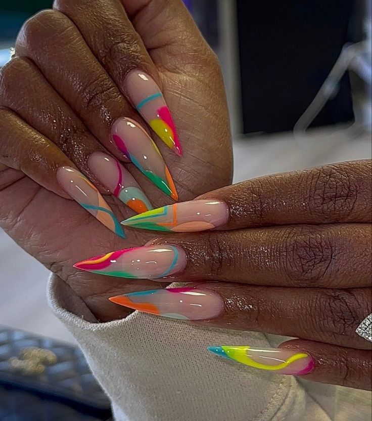 A set of stiletto shaped nails with designs