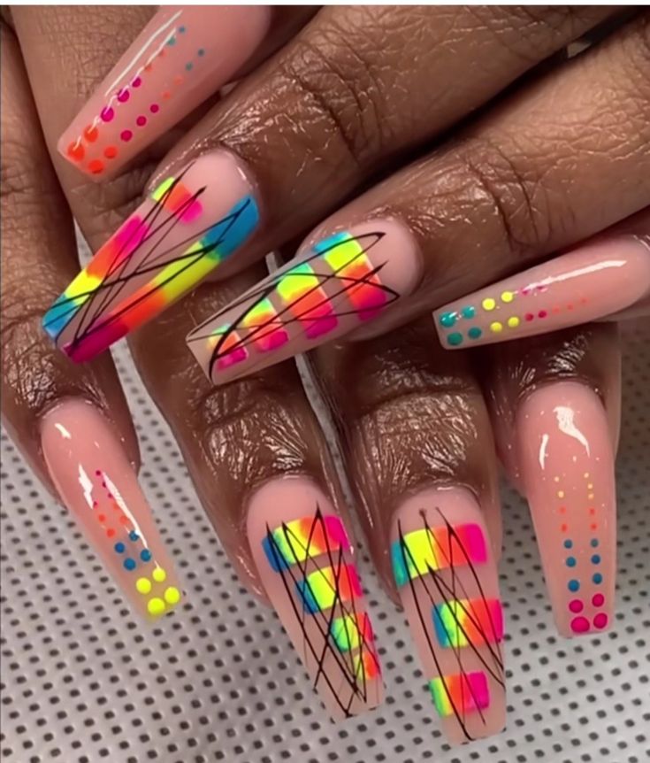 Coffin shaped acrylic nails with rainbow nail art designs