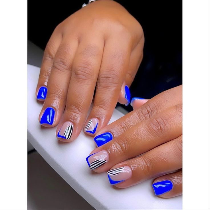 Cobolt blue short nails with animal print designs 