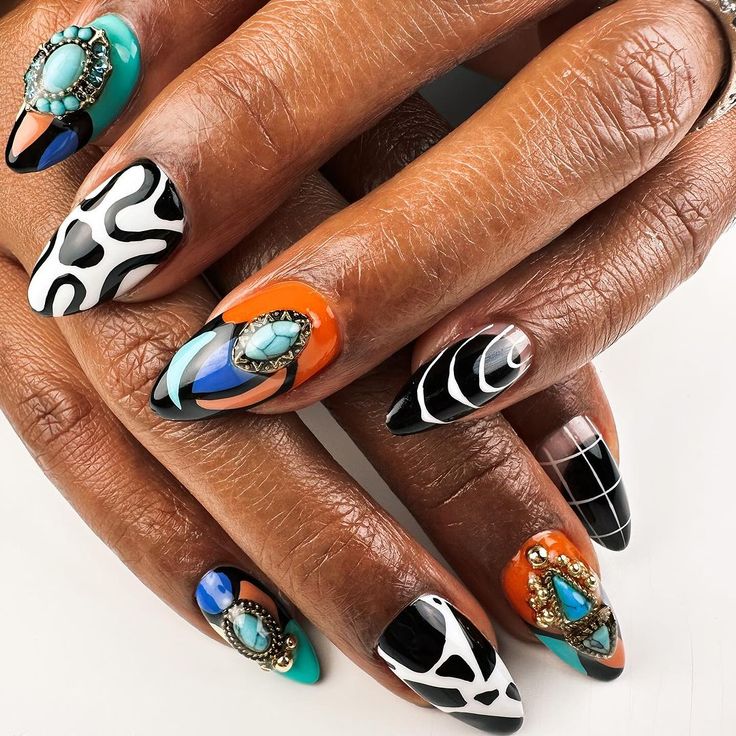 A set of nail with black and orange geometric designs 